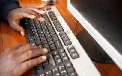 Person typing using a computer keyboard