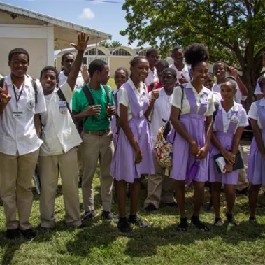 Male and female students standing outside