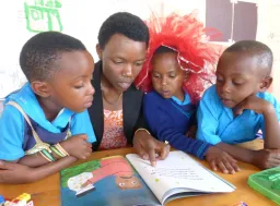 Teacher reading to young children